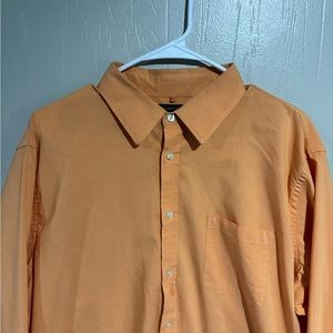 Long sleeve button-down, collared dress shirt.